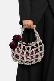 ALKAB SILVER AND PLUM HAND BAG